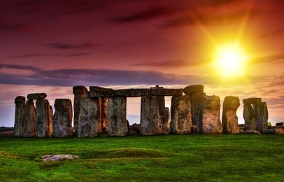 fantasy sunset at stonehenge with dramatic sky and sun rays
