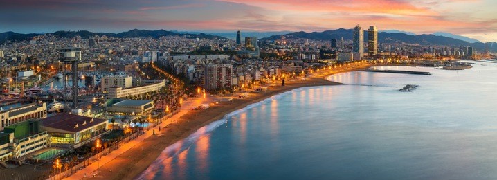 barcelona beach on morning sunrise with barcelobna city and sea from the roof top of hotel, spain