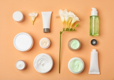 flat lay composition with cosmetic products on color background