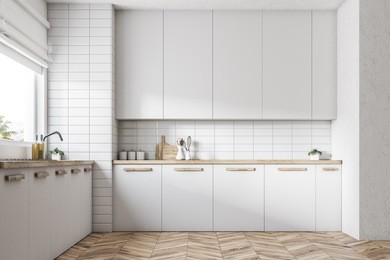 white kitchen interior with a wooden floor, white countertops and a large window. 3d rendering mock up