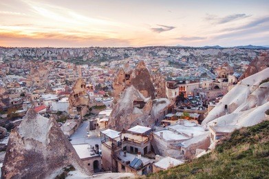 goreme, cappadocia, turkey on sunset. famous center of balloon fligths.