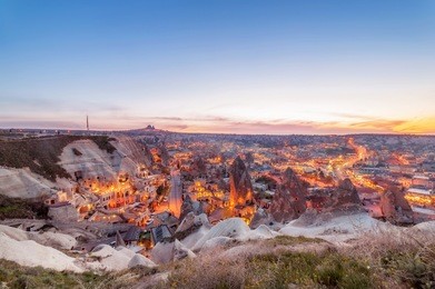 beautiful view goreme, cappadocia, turkey on sunset. famous center of balloon fligths.