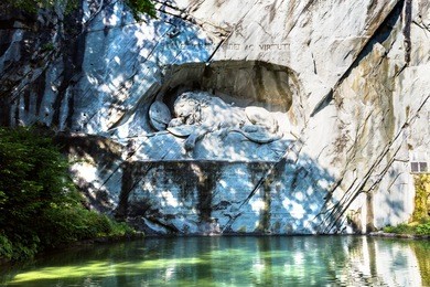dying lion monument in lucerne in a beautiful summer day, switzerland