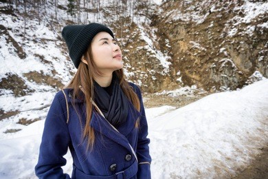 young asian women enjoy in snow fall for the first time.winter young asia woman portrait on snow winter time.