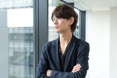 young asian man in office room.
