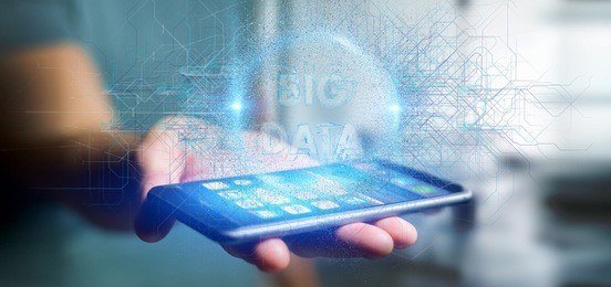 view of a particles big data title holding by a man