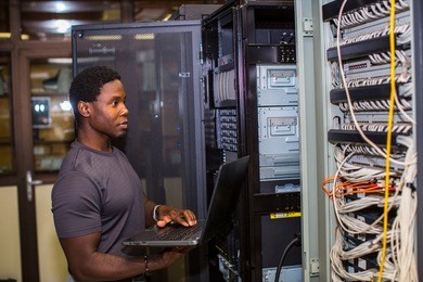 engineer inspecting a rack