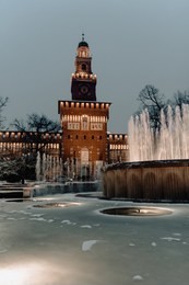 snow in milan, italy. sforzesco castle.