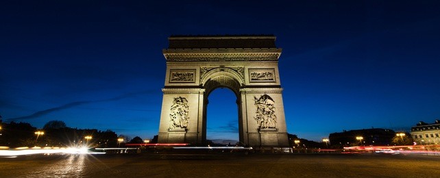 panoramic view of arc de triomphe in paris, france at night