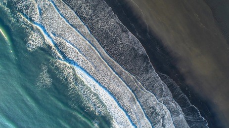 the black sand beach in iceland. sea aerial view and top view. amazing nature, beautiful backgrounds and colors.