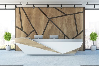 futuristic reception desk with two computers in an office interior with wooden geometric pattern walls and potted trees. 3d rendering mock up
