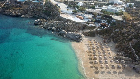 aerial drone, bird's eye view photo of iconic and famous beach of super paradise with sapphire clear waters, mykonos island, cyclades, greece