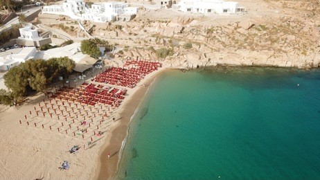 aerial drone, bird's eye view photo of iconic and famous beach of super paradise with sapphire clear waters, mykonos island, cyclades, greece