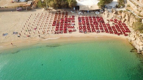 aerial drone, bird's eye view photo of iconic and famous beach of super paradise with sapphire clear waters, mykonos island, cyclades, greece