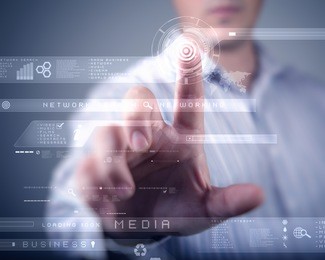 businessman standing and working wth touch screen technology