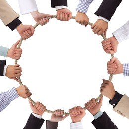 hands holding rope forming a circle