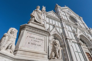 statue of dante alighieri located in the piazza di santa croce in florence, italy