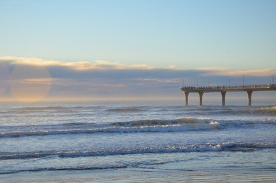 new brighton beach is a best spot to visit for sunrise and play amongst the waves under the pier or maybe take a stroll along the top and watch the fishermen.