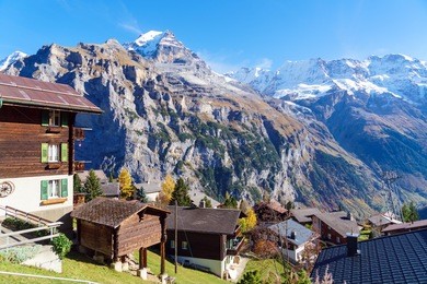 traditional chalets of murren village and jungfrau montain at autumn, berner oberland, switzerland