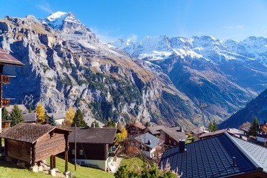 traditional chalets of murren village and jungfrau montain at autumn, berner oberland, switzerland