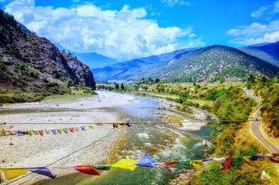 the scenic views of the punakha valley , pho chhu river and surrounding mountains. 