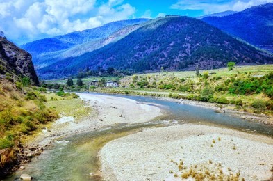 the scenic views of the punakha valley , pho chhu river and surrounding mountains. 