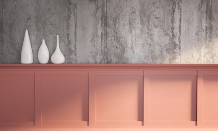 3d rendering illustration of colorful modern interior on sunny morning. gray rough concrete wall, classic coral rose panel with molding and set of white fashion vases. 