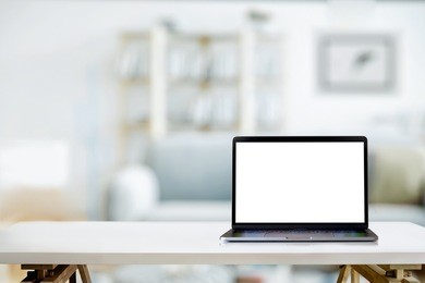 mock up : contemporary workspace with laptop computer at living room in home