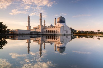 floating mosque with reflection during sunrise. formerly known as likas mosque or masjid bandaraya likas, kota kinabalu, sabah, malaysia.