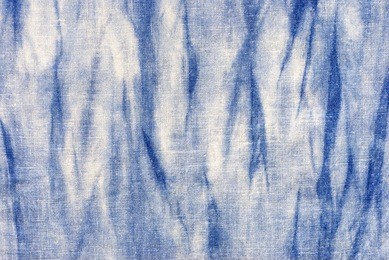 natural indigo blue tie dye on linen fabric texture  