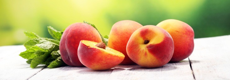 a group of ripe peaches on table. fresh peach concept