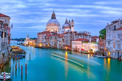 grand canal and the basilica of st mary of health or basilica di santa maria della salute at night in venice, italy