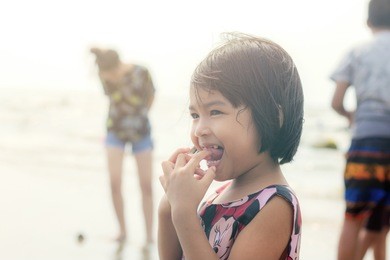 asian girls are stand at the sea.