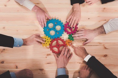 business team connect pieces of gears. teamwork, partnership and integration concept