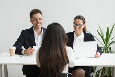 friendly hr managers interviewing female job applicant, professional smiling recruiters talking to winning vacancy candidate making hiring decision, good performance or great first impression concept