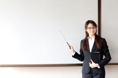 asian businesswoman and blank whiteboard