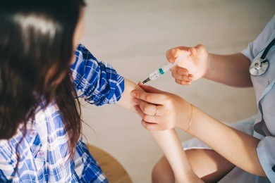 little girls trust a young woman doctor.