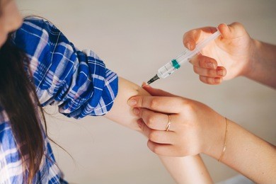 little girls trust a young woman doctor.