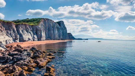 picturesque spring landscape of famous xi beach. sunny morning scene of cephalonia island, greece, europe. attractive seascape of ionian sea. traveling concept background.
