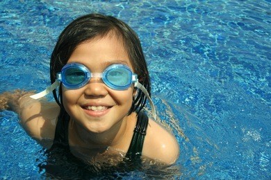 young girl having good time in the pool.