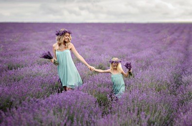 mom and daughter in a field of lavender.