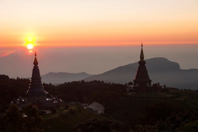 sunrise over two pagodas noppamethanedol & noppapol phumsiri in doi inthanon mountain, thailand