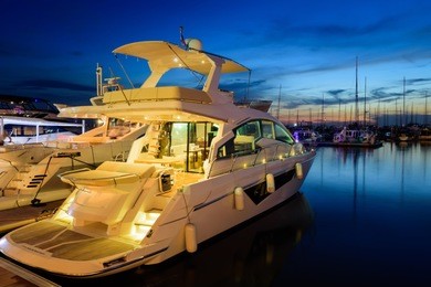 view of harbor and marina with moored yachts and motorboats in pattaya thailand