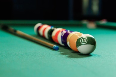 billiard balls are lined up on a billiard table, american billiards. sports games, outdoor activities.