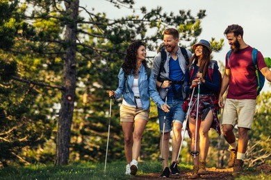 shot of a group of friends having fun while hiking together through the woods.