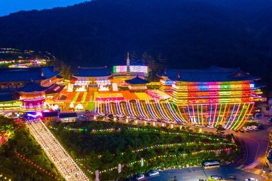 aerial view of samgwangsa temple at nighttime in busan city, south korea.thousands of paper lanterns decorate samgwangsa temple in busan city of south korea for buddha's birthday.