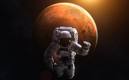 astronaut on background of mars. image in 5k resolution for desktop wallpaper. elements of the image are furnished by nasa