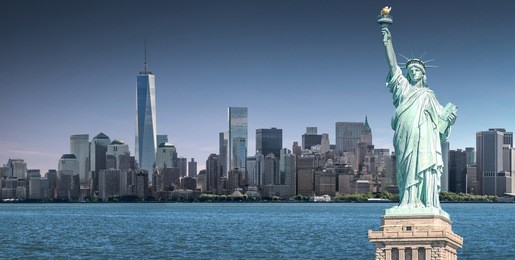 the statue of liberty with high-rise building in lower manhattan background, landmarks of new york city, usa