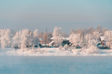 winter landscape of small town in countryside area of siberia, russia