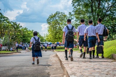 the high school students are going back home after school in thailand, southeast asia.